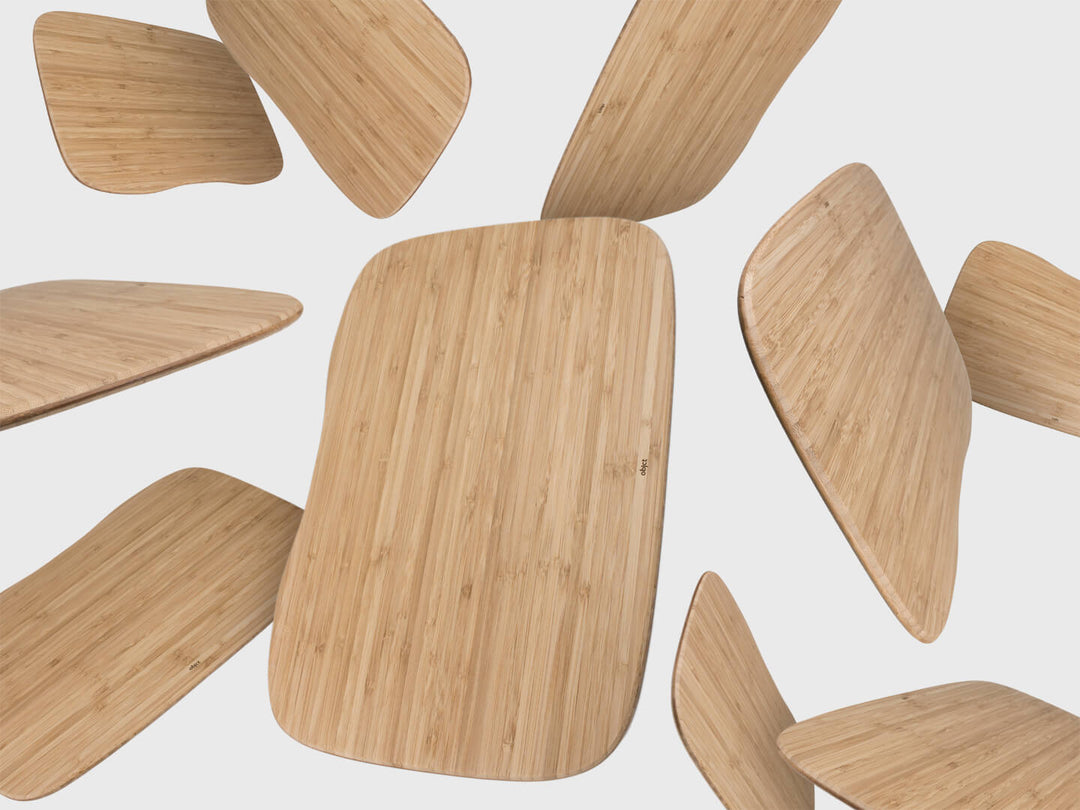 Numerous bamboo Lapod lap desk thin, strong tray tables by ObjctCo floating in air. Made from natural sustainable materials