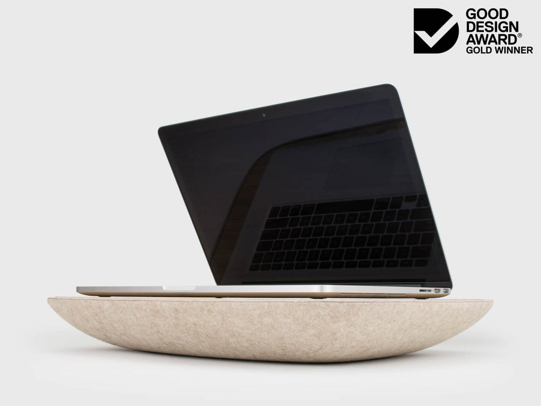 Australian Good Design Award Gold Winner logo next to Lapod Lap Desk with Storage by Objct Co entry, with laptop