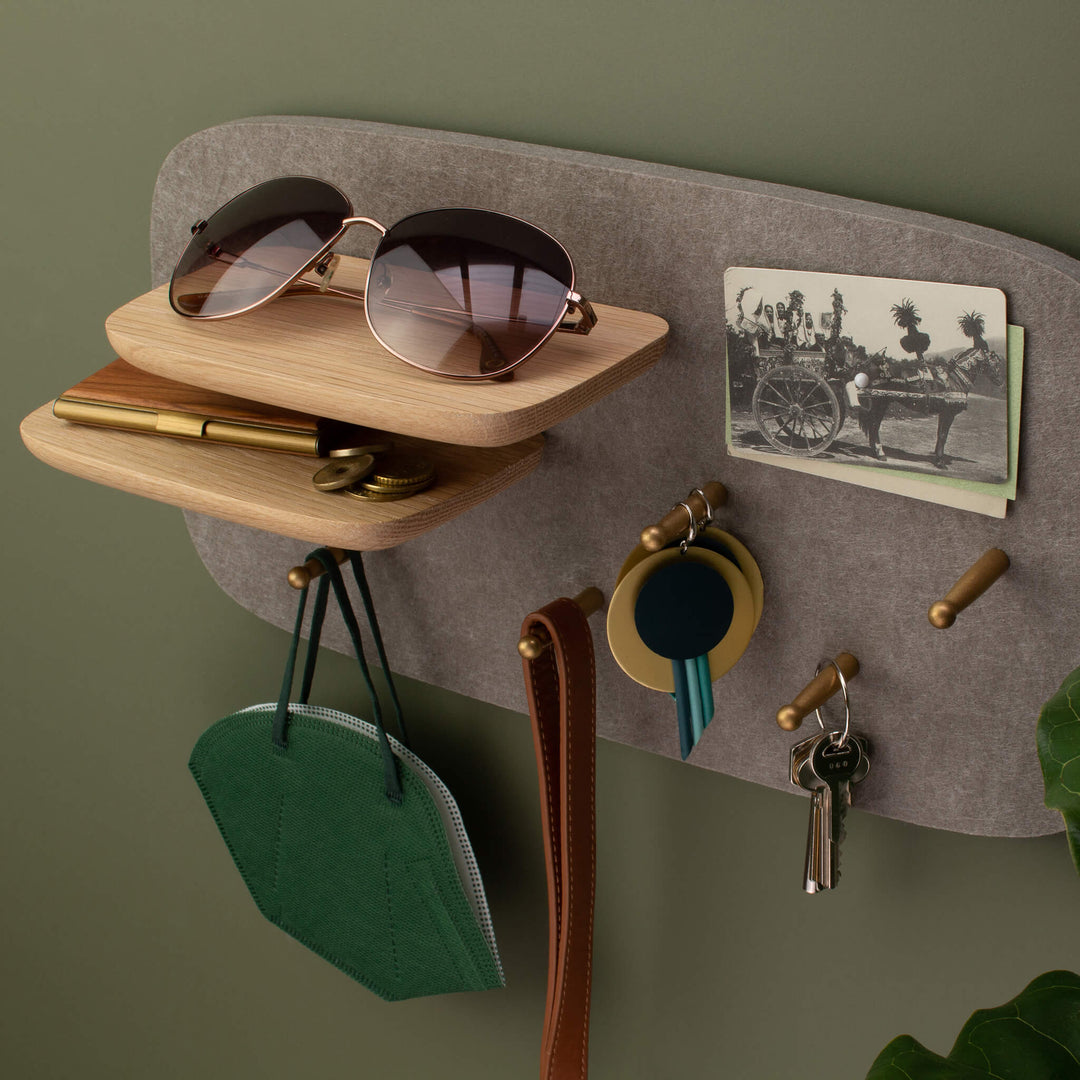 Mantel Pegboard, Pebble / 2Peg Shelf, on green wall, holding EDC like items keys, wallet, sunglasses, ear rings & face mask.