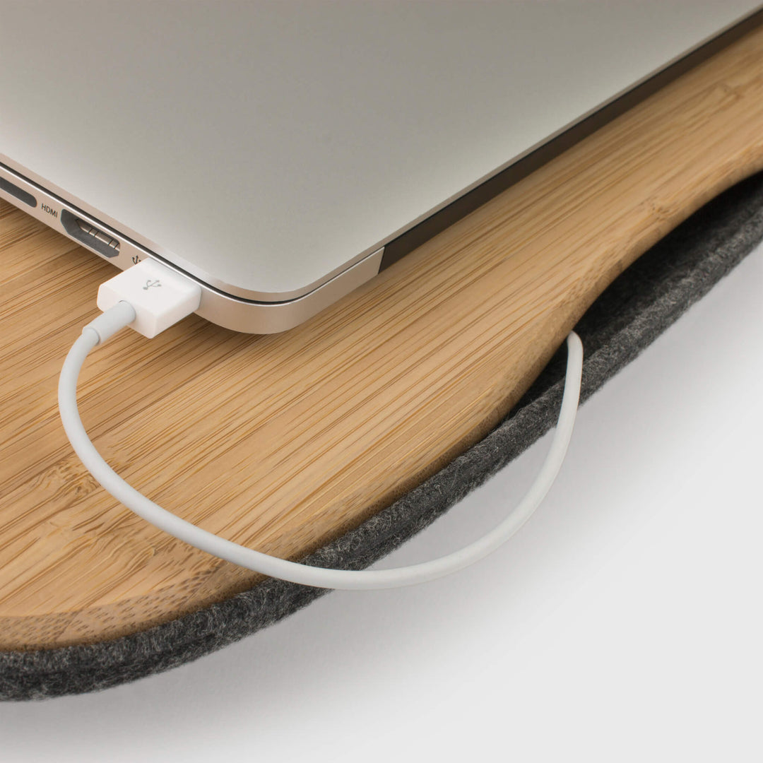 Detail of USB cable management from laptop into lap table of Lapod Lap Desk by Objct. Sustainable Charcoal or Ash Grey
