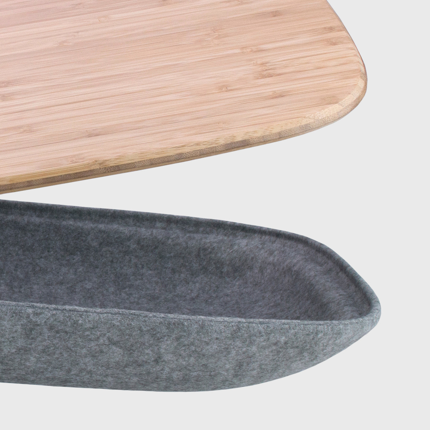 Detail of Lapod Lap Desk with Storage showing closeup of bamboo lap tray, right side. PET felt is Ash grey color.